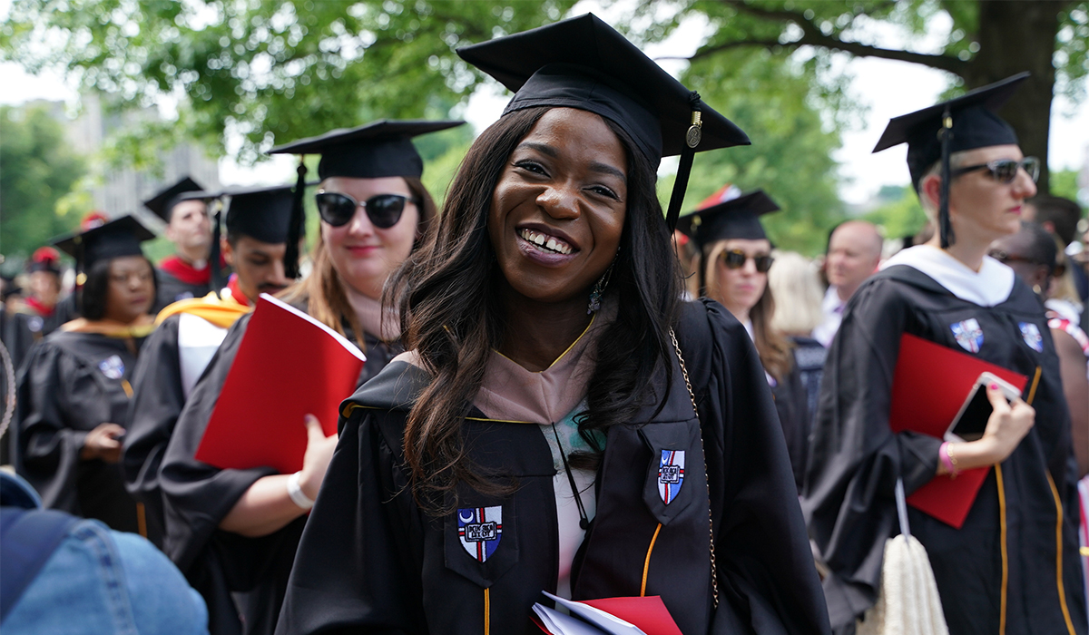 Female student smiling at Commencement